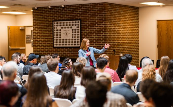 Image of Jennifer Needham speaking to students