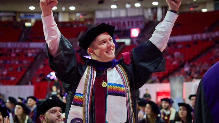 OU Law Graduate celebrating