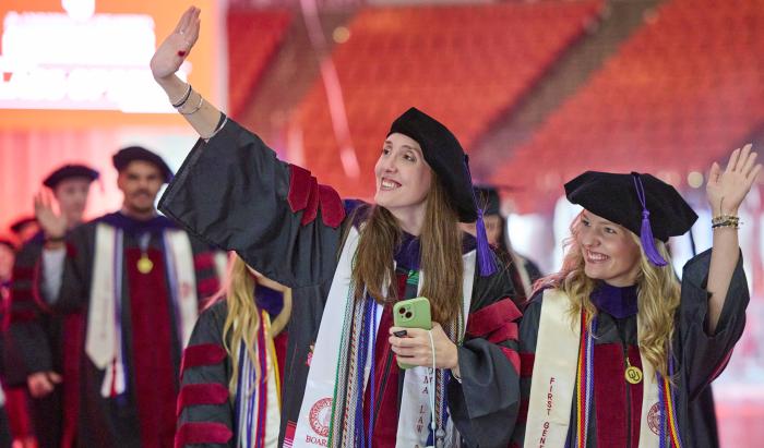 Students smiling at graduation
