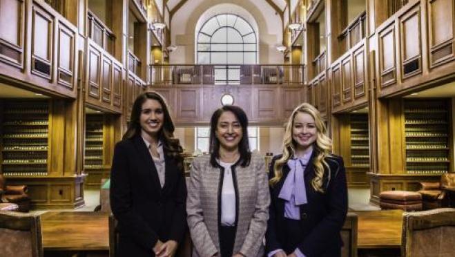 Three people in the Great Reading Room