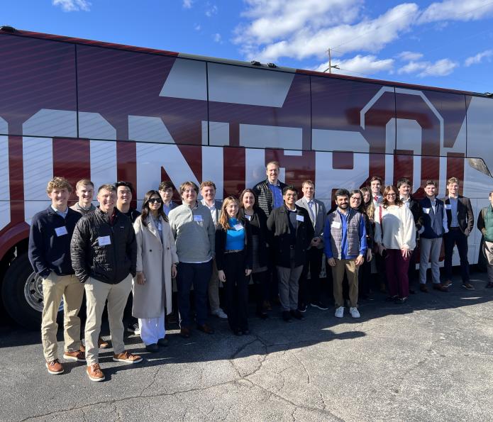 First-year students in front of bus