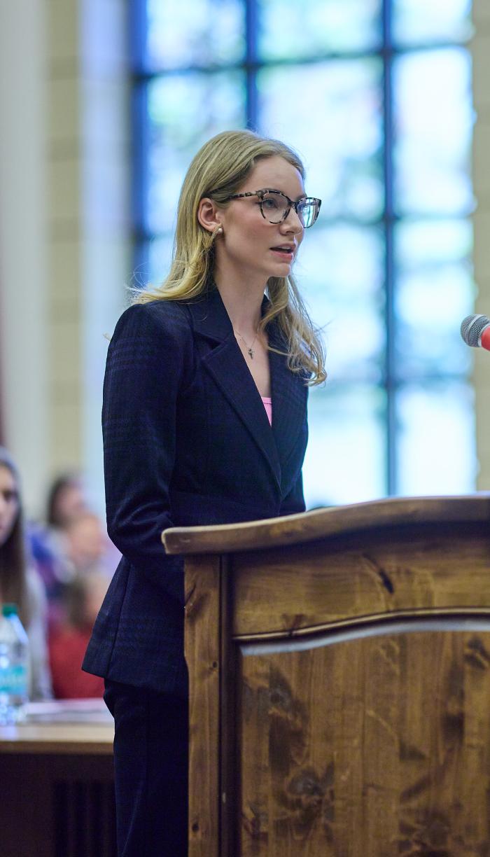 Student speaking from courtroom podium